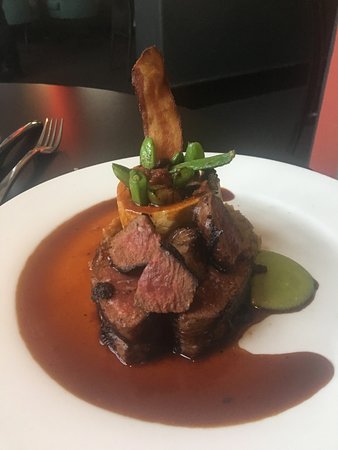 Coyote Cafe & Rooftop Cantina signature dishes Tellicherry Peppered Elk TenderloinMesquite Grilled Lobster TailsPatagonian Sea Bass